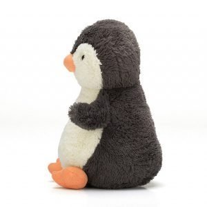 A side view of peanut penguin from Jellycat.