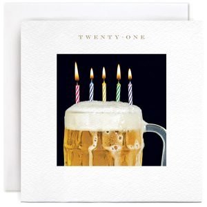 A 21st birthday card with a photograph of a pint of beer with birthday candles in it