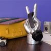 A brilliant ornamental stand that has been moulded in the shape of the Peace sign. The hand is realistic but has been painted with a silver effect.