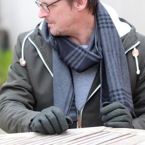 A charcoal grey and black checked scarf. A long check pattern and super soft feel