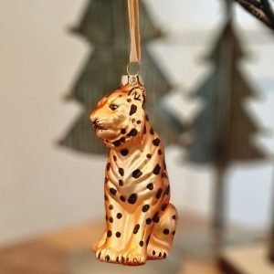 A glass leopard hanging decoration. Painted in gorgeous orange and gold with black glitter spots this cool creature will be captivating on your tree