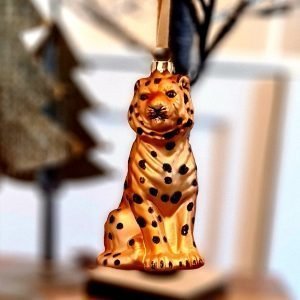 A glass leopard hanging decoration. Painted in gorgeous orange and gold with black glitter spots this cool creature will be captivating on your tree