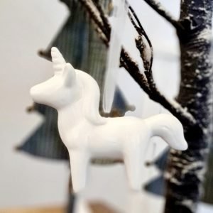 A white porcelain hanging decoration. Perfect for hanging on the Christmas tree
