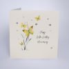 A beautiful card from Five Dollar Shake with an image of grass and butterflies and the words Happy Golden Wedding Anniversary are printed on the card.