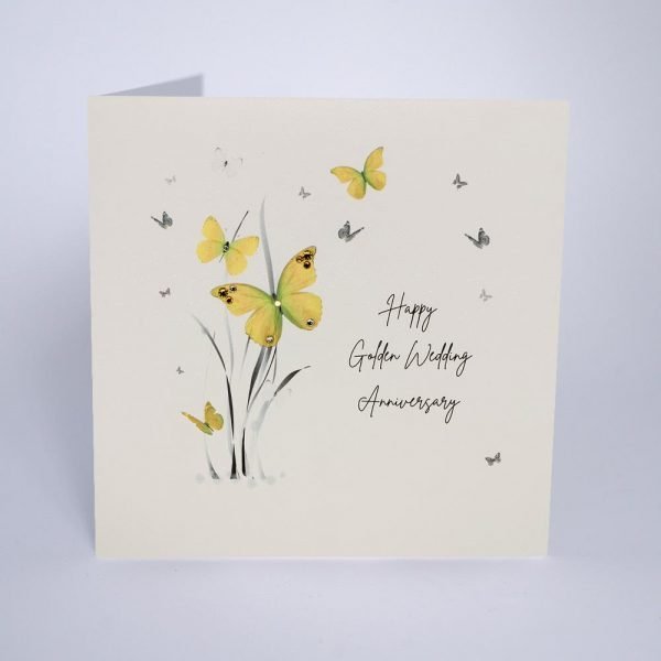 A beautiful card from Five Dollar Shake with an image of grass and butterflies and the words Happy Golden Wedding Anniversary are printed on the card.