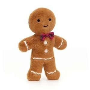 A gingerbread man cuddly toy with a tartan bow tie from jellycat