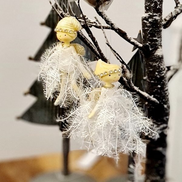 A girl fairy hanging decoration with a white tinsel dress