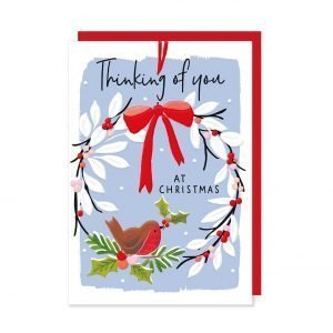 A lovely Thinkging of you chrismtas card with a sweet wreath on it with a cute robin on it.