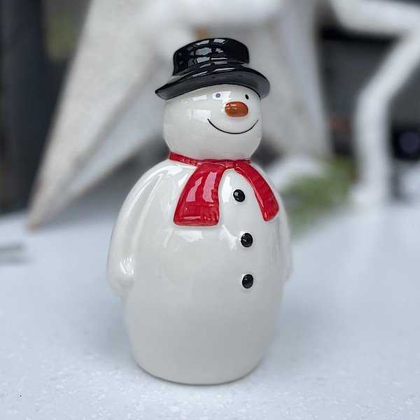 Ceramic Sitting Snowman decoration in three different sizes, wearing black hat and red scarf.