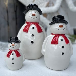 Ceramic Sitting Snowman decoration in three different sizes, wearing black hat and red scarf.