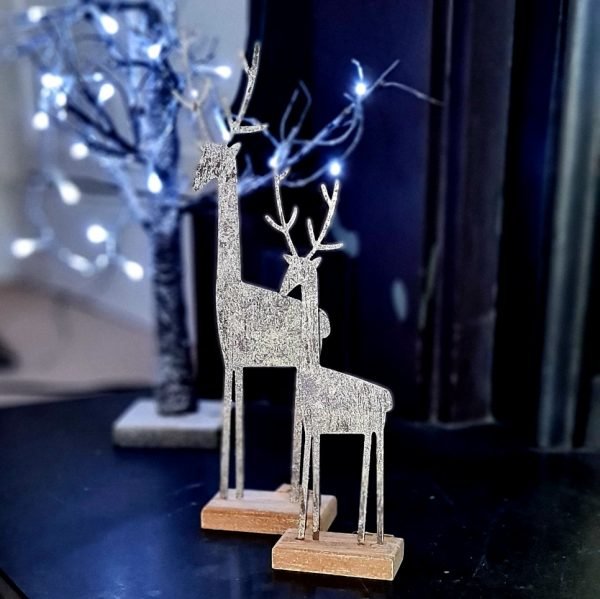 Silver metal reindeer on a wooden base, small and large reindeers available