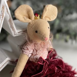 A sweet material mouse made from cotton and wearing a plum coloured feathered net dress