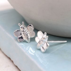 A pair of sterling silver stuff earrings that are shaped like tiny bumblebees.
