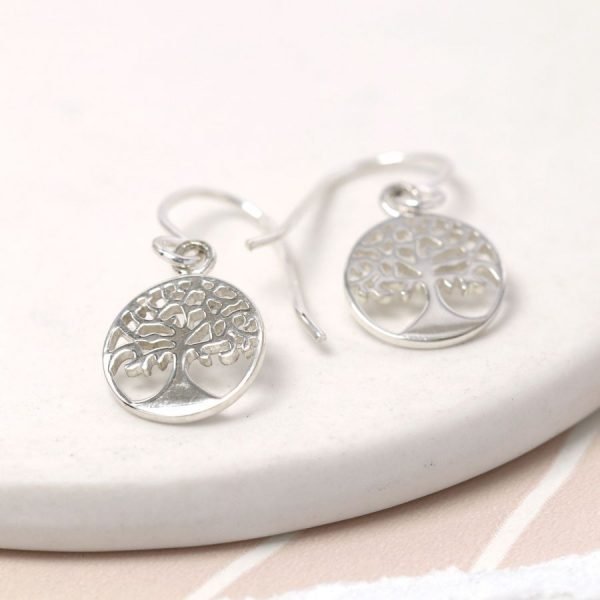 A pair of sterling silver drop earrings with a tree of life design.