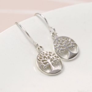 A pair of sterling silver drop earrings with a tree of life design.