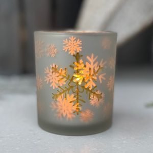 A gorgeous white snowflake votive candle holder with gold effect and frosted snowflakes. Available in 2 different sizes.