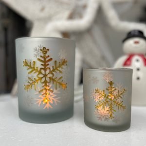 A gorgeous white snowflake votive candle holder with gold effect and frosted snowflakes. Available in 2 different sizes.