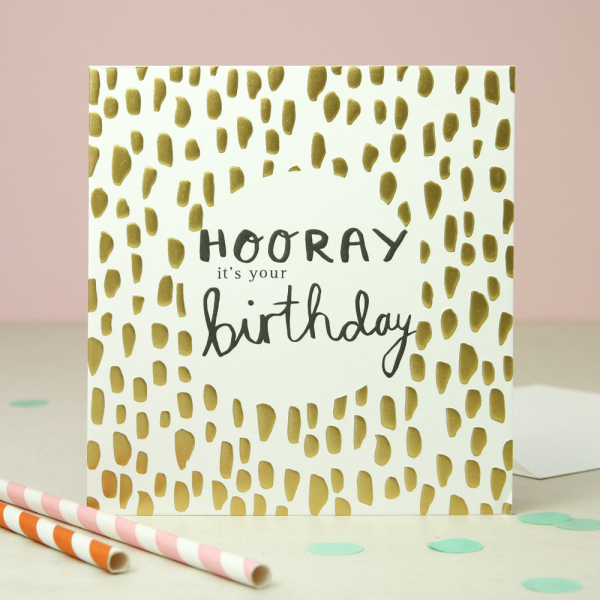 Hooray birthday card. A card with gold foil dots and hooray its your birthday in black calligraphy style writing