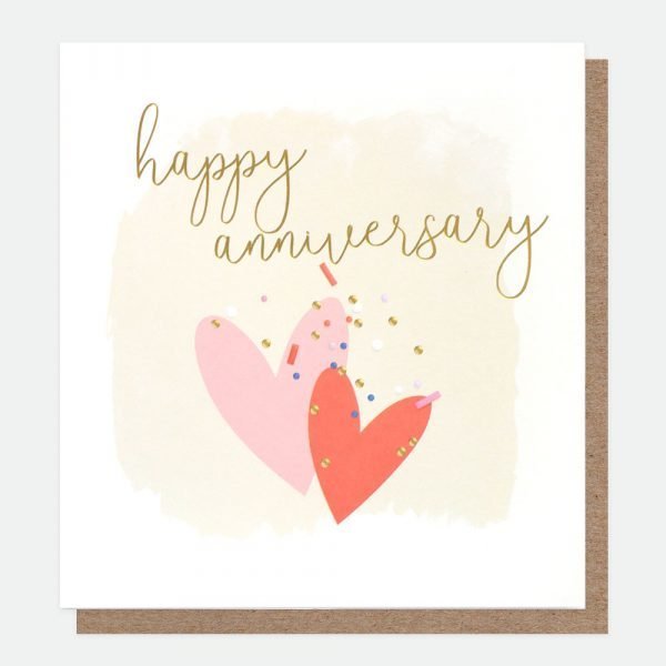 Happy Anniversary card with a pair of hearts one pink one red and gold foil little hearts and the words happy anniversary