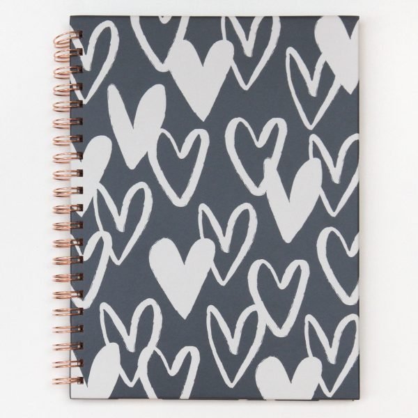 Charcoal hearts notebook. An A4 spiral bound notebook with a grey and white heart design and 200 pages