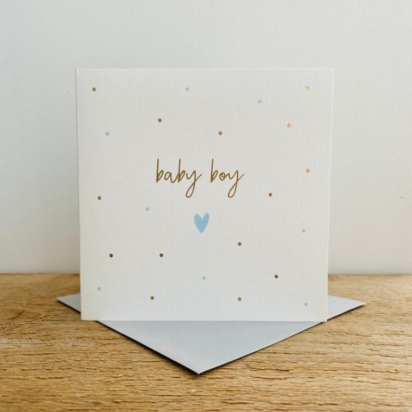 A square white card with gold spots and a blue heart on it and the words Baby Boy in gold print