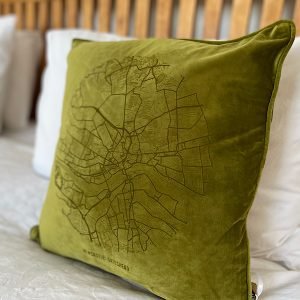 A fabulous bamboo green coloured velvet cushion with a map of Newcastle and Gateshead imprinted on it.
