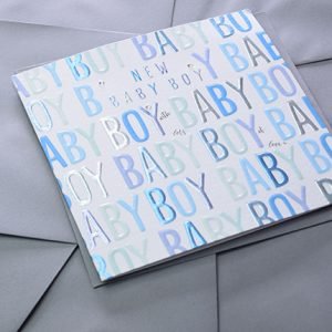 A cute card with Baby Boy in different shades of blue embossed and printed all over it.