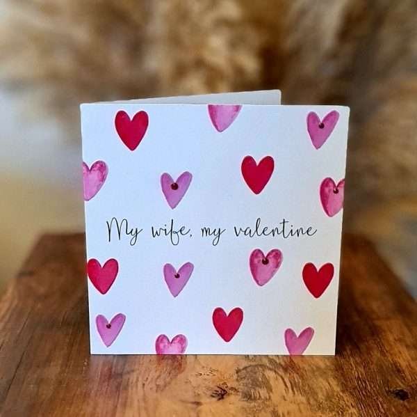 A large square Valentine's day car with lots of hearts in pinks and reds on a white background . My Wife My Valentine