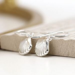 A pair of sterling silver drop earrings with a clam shell design