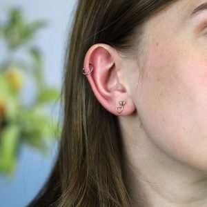 A pair of gold plated double heart stud earrings