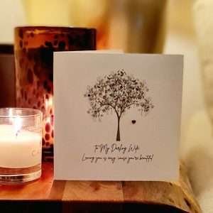 To My Darling Wife Valentine's Day Card by Five Dollar Shake.. A luxury white shimmering board printed with a tree with a red crystal heart hanging from the tree. Embellished with colourful crystals. The caption reads