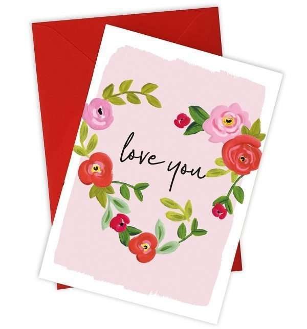 A wonderful Valentine's card with a heart made up of flowers and leaves with the words Love You printed in the middle of the heart.