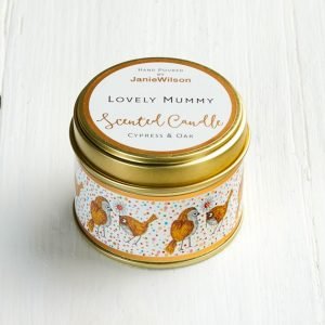 A scented cypress and oak mini candle in a tin decorated with little birds and Lovely Mummy