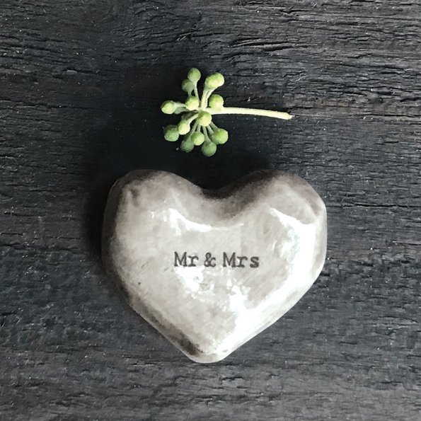 A grey ceramic token with the words Mr & Mrs written on it.
