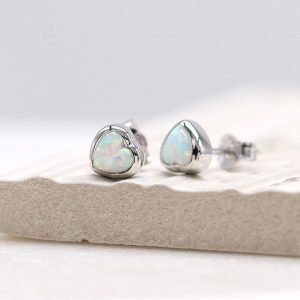 A stunning pair of sterling silver heart stud earrings with white opal centre.