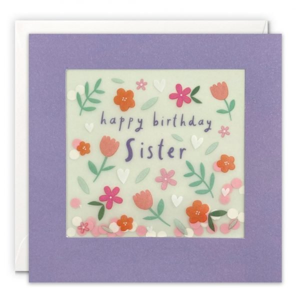 A sister birthday card. The image on the front features leaves, flowers and hearts on a turquoise background. The text on the front reads 'Happy Birthday Sister'.. The image is printed on translucent paper, showing coloured confetti dots behind. The confetti moves around when you shake the card. The card is purple