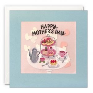 A Mother's Day card with an image of a white table laid with a traditional afternoon tea, on a pink background with "Happy Mother's Day" printed over the top. Printed on translucent paper with colourful heart confetti behind