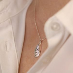 A wonderful sterling silver pendant shaped like a paua shell on a silver chain