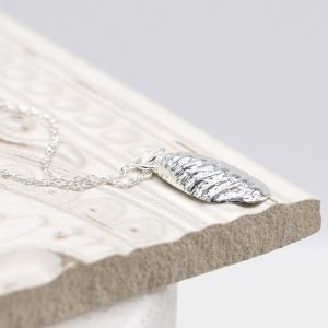A wonderful sterling silver pendant shaped like a paua shell on a silver chain
