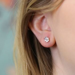 A pair of sterling silver daisy studs with cubic zirconia centre