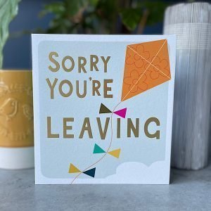 A square card with a colourful kite and the words Sorry You're Leaving printed on it