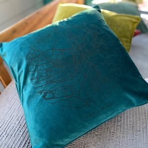 A fabulous teal coloured velvet cushion with a map of Newcastle and Gateshead imprinted on it.