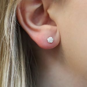 A pair of sterling silver rose shaped stud earrings