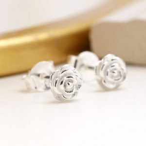 A pair of sterling silver rose shaped stud earrings
