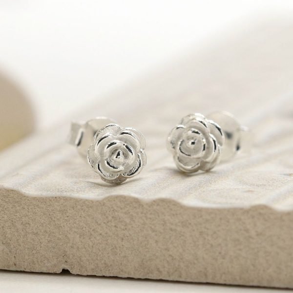 A pair of sterling silver rose shaped stud earrings