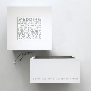 A large white wooden box with the words