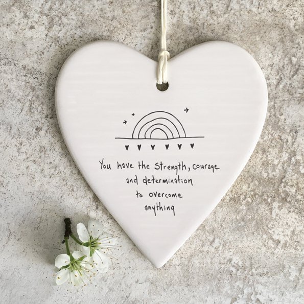 A ceramic hanging heart with the words You have the strength courage and determination to overcome everything.