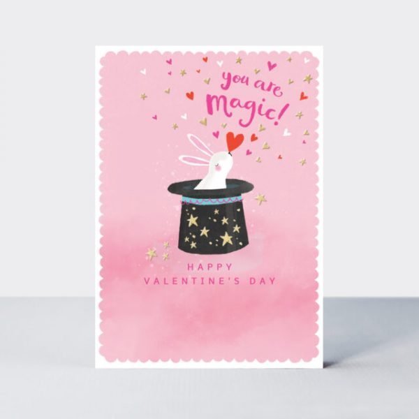 A cute card with an image of a black magic hat with a white rabbit popping out of it. The words You are Magic Happy Valentines day are printed on the card.