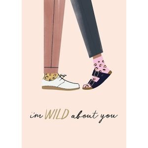 A Valentine's day card with a pair of legs. i'm wild about you on the front