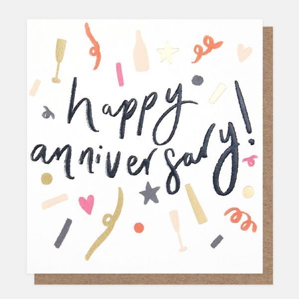 An anniversary card with confetti and happy anniversary printed in black